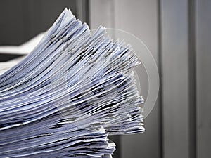 The stack of documents placed on the desk