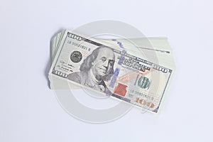stack of dollar bills isolated on white background.