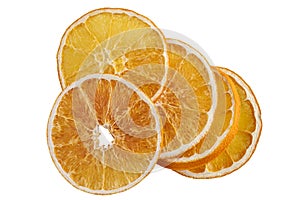 Stack of dried orange slices isolated on white