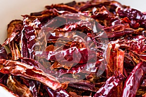 Stack of Dried Red Chili or Chilli Cayenne Pepper in Bowl