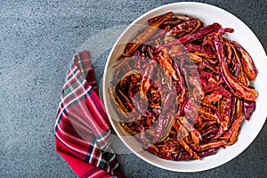 Stack of Dried Red Chili or Chilli Cayenne Pepper in Bowl