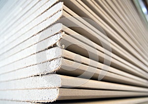 A stack of drywall sheets in stock