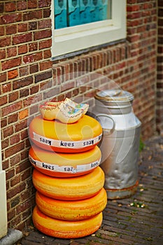 Stack of Dutch cheese wheels on a street in Amsterdam, the Netherlands