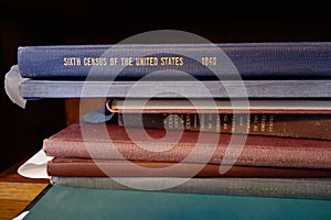 Stack of early United States census books photo