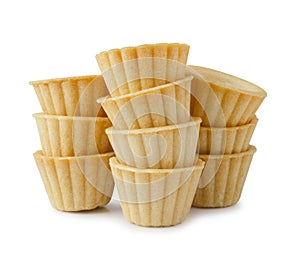 Stack of empty tart shells isolated