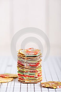 Stack english paper pieced hexagons on white craft mat