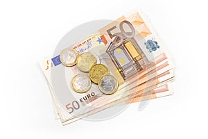 Stack of Euro banknotes and coins isolated. 50 Euro banknotes.