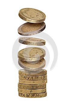 Stack of falling one pound and two euro coins on white background