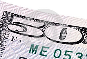 A stack of fifty 50 dollar bills on white background.