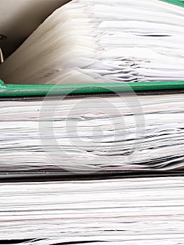 Stack of file folders with documents