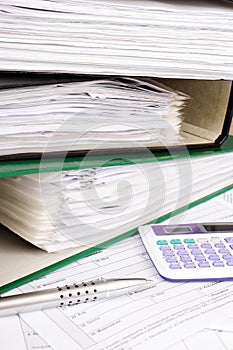 Stack of file folders with documents