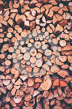 Stack of firewood, wood background texture. Layer of stored cut