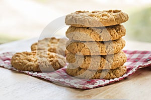 Stack of five Anzac biscuits.