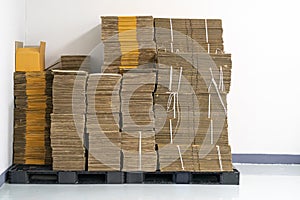 Stack of flat pack cardboard boxes for product packaging photo