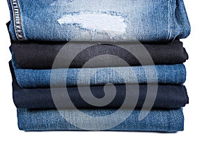 Stack of Folded Blue Jeans in Various Styles