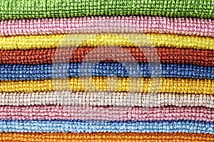 Stack of folded microfiber towels close-up background backdrop