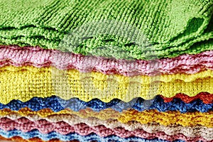 stack of folded microfiber towels close-up background backdrop