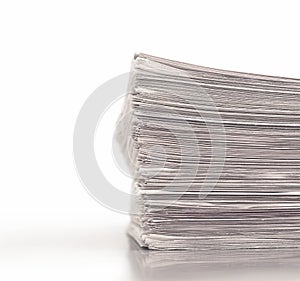 A stack of folded newspapers