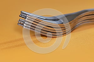 Stack of forks isolated on yellow background