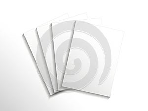 A stack of four blank white papers on a clean white background isolated on white background