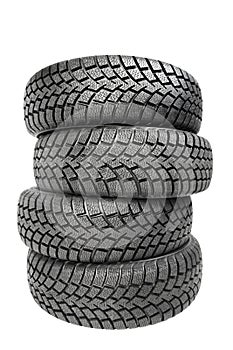 Stack of four car wheel winter tires isolated