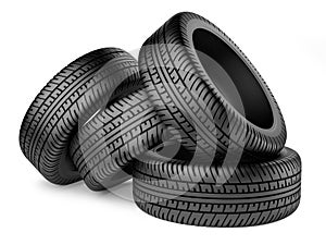 Stack of four new black wheel tyres for car photo