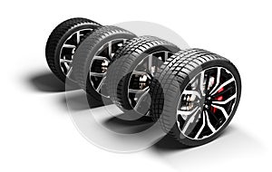 Stack of four performance car wheels on white background