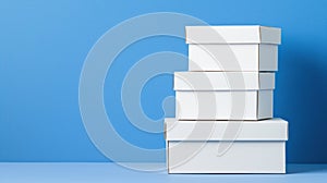 A stack of four white boxes.