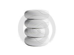 Stack of four white circular objects isolated on white background