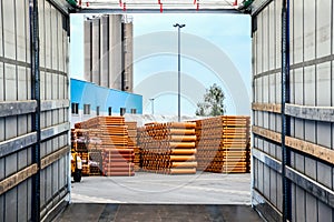 Stack of Freight Containers at the Docks with Truck