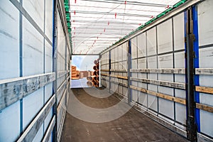 Stack of Freight Containers at the Docks with Truck