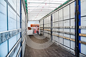 Stack of Freight Containers at the Docks with Truck