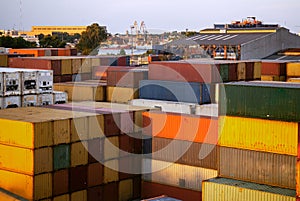 Stack of freight shipping containers at the docks. cargo port