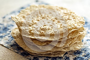 Stack of fresh armenian homemade lavash bread on plate