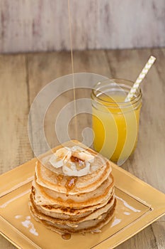 Stack of Fresh Pancakes With Syrup Drizzling