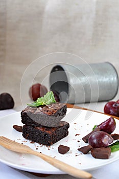 Stack of Fudge Brownies on White plate