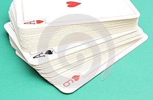 Stack of game cards on green background