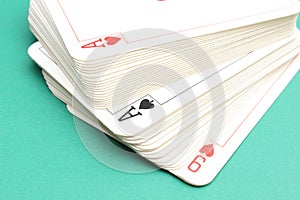 Stack of game cards on green background