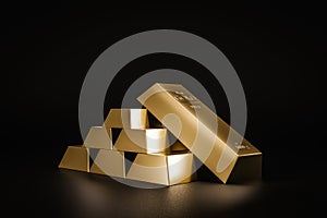 Stack of gold bars on dark background of wealth from trading profits of fast growing businesses. Contracting profit in stock