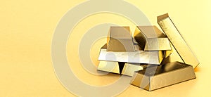 Stack of gold bars on yellow background, reserve of value concept. Copy space. 3d rendering