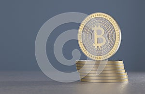 Stack of gold and silver bitcoins as example for crypto-currency in front of blurred blue background