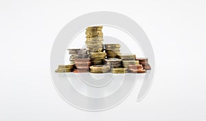 Stack of gold and silver coins isolated on white background with clipping path without a shadow. Growing and saving money concep