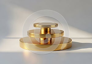 Stack of golden circular objects in minimalist setting