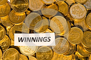 Winnings sign at a coin stack photo