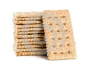 Stack of grain crispbreads isolated on white background