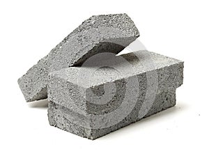 Stack of gray clay bricks for construction