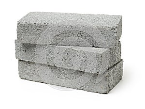 Stack of gray clay bricks for construction