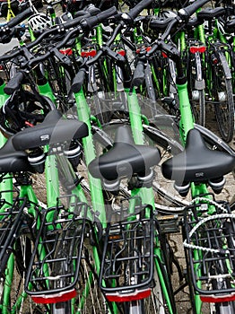 Stack of Green Bicycle Rentals