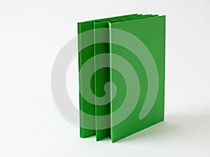 Stack of green binders isolated on white background