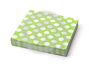 Stack of green dotted paper napkins